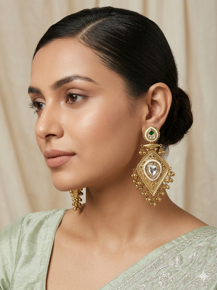 Regal Kundan Pearl Drop Earrings with Intricate Gold-Tone Engraving and Ghungroo Tassel Detailing for Festive Traditional Elegance